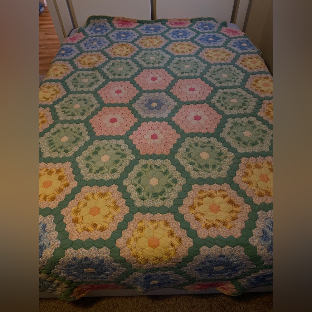 Vintage grandmother’s flower garden quilt